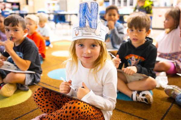Students inside their classrooms learning. 